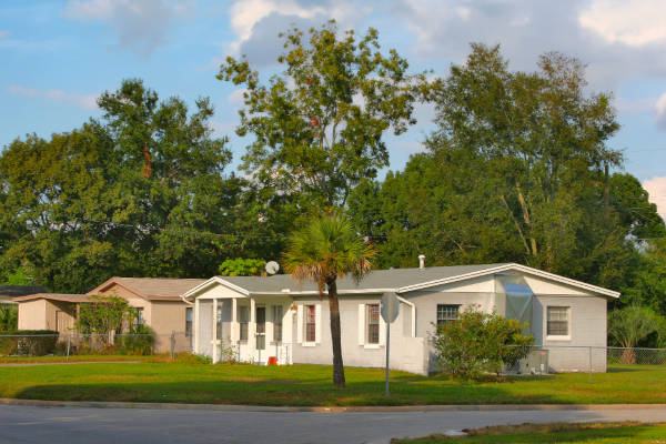 residential-neighborhood-scene A picturesque scene of a residential neighborhood featuring a single-story house.